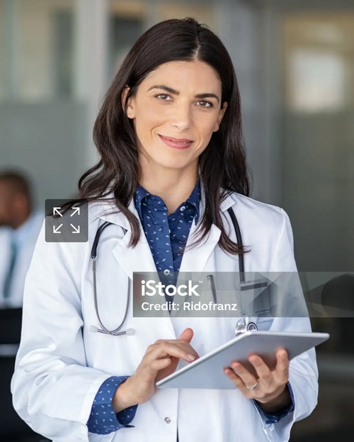 Doctor with digital tablet in a conference room